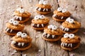 Heloween dessert: funny monsters made of biscuits with chocolate Royalty Free Stock Photo