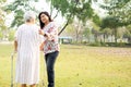 Help and care Asian senior or elderly old lady woman use walker with strong health while walking at park Royalty Free Stock Photo