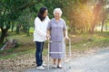 Help and care Asian senior or elderly old lady woman use walker with strong health while walking at park Royalty Free Stock Photo