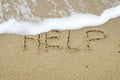 HELP written on sand Royalty Free Stock Photo