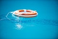 Help and drowning concept. Life saver ring floating in the water. Royalty Free Stock Photo