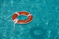 Help and drowning concept. Life saver ring floating in the water. Royalty Free Stock Photo