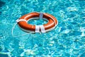 Help and drowning concept. Life saver ring floating in the water. Royalty Free Stock Photo