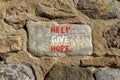 Help give hope symbol. Concept word Help give hope on beautiful big stone. Stone wall. Beautiful stone wall background. Business Royalty Free Stock Photo