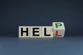 Cubes form words Help or Hell. The concept of help in business and support in both business and personal life Royalty Free Stock Photo