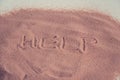 `Help` inscription on the sand Royalty Free Stock Photo