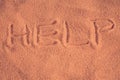`Help` inscription on the sand Royalty Free Stock Photo