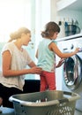 Help, laundry and mom with kid at washing machine for chores, teaching and learning housekeeping routine. Home, mother Royalty Free Stock Photo