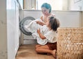 Help, laundry and washing machine with mother and daughter for cleaning, learning and cleaner. Housekeeping, teamwork Royalty Free Stock Photo