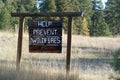 Help prevent forest fires sign Royalty Free Stock Photo