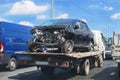 wrecker transports broken car