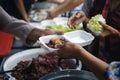 Help serving free food to the poor Needy : concept Hunger