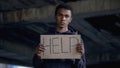 Help sign in black teenager hands, sad violence victim, human rights, bullying