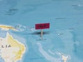 `HELP!` Sign with Pole on New Caledonia of the World Map