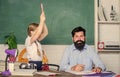 Help study. Discipline and upbringing. Man bearded pedagogue study together with kid. Study is fun. School teacher and