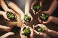 Help sustain what has sustained you. a group of people holding plants growing out of soil. Royalty Free Stock Photo