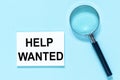 Help wanted mesage on keyboard on blue background Royalty Free Stock Photo