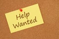 Help wanted message on index card on bulletin board