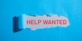 Help Wanted message on torn paper Royalty Free Stock Photo