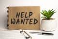 Help Wanted paper notepad on office work place Royalty Free Stock Photo