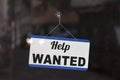 Help wanted sign in the window of a shop Royalty Free Stock Photo