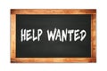 HELP  WANTED text written on wooden frame school blackboard Royalty Free Stock Photo