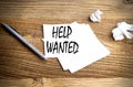 HELP WANTED text written on sticky on wooden background Royalty Free Stock Photo