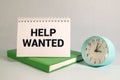 HELP WANTED text written on a sticky on wooden background Royalty Free Stock Photo
