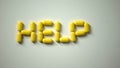 Help word made of pills on table, international illness awareness, campaign Royalty Free Stock Photo