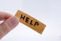 Help word on a piece paper Royalty Free Stock Photo