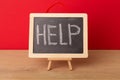 Help word written on school blackboard Royalty Free Stock Photo