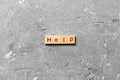 Help word written on wood block. Help text on table, concept Royalty Free Stock Photo