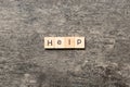 Help word written on wood block. Help text on table, concept Royalty Free Stock Photo