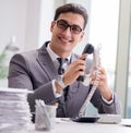 Helpdesk operator talking on phone in office Royalty Free Stock Photo