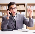 Helpdesk operator talking on phone in office Royalty Free Stock Photo