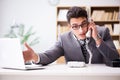 The helpdesk operator talking on phone in office Royalty Free Stock Photo