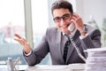 The helpdesk operator talking on phone in office Royalty Free Stock Photo