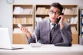 The helpdesk operator talking on phone in office Royalty Free Stock Photo