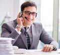 Helpdesk operator talking on phone in office Royalty Free Stock Photo