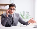 Helpdesk operator talking on phone in office Royalty Free Stock Photo