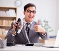 Helpdesk operator talking on phone in office Royalty Free Stock Photo