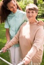 Helpful caregiver with senior