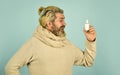 helpful nasal spray. man use nasal drops during course of disease. happy man says no to flu. coronavirus from china Royalty Free Stock Photo