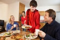 Helpful Teenage Children Serving Food