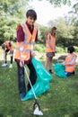 Group Of Helpful Teenagers Collecting Litter In Countryside Royalty Free Stock Photo
