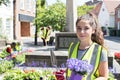 Group Of Helpful Teenagers Planting And Tidying Communal Flower