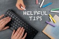 Helpful Tips. Computer keyboard with colored pieces of chalk on a chalkboard background Royalty Free Stock Photo