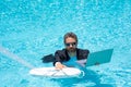 Helping businessman. Businessman in suit hold laptop and lifebuoy in sea beach water. Rescue businessman. Helping Royalty Free Stock Photo