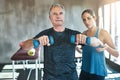 Helping, dumbbell and coaching with old man and personal trainer for support, health and physiotherapy. Training Royalty Free Stock Photo