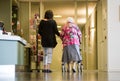 Helping elderly woman
